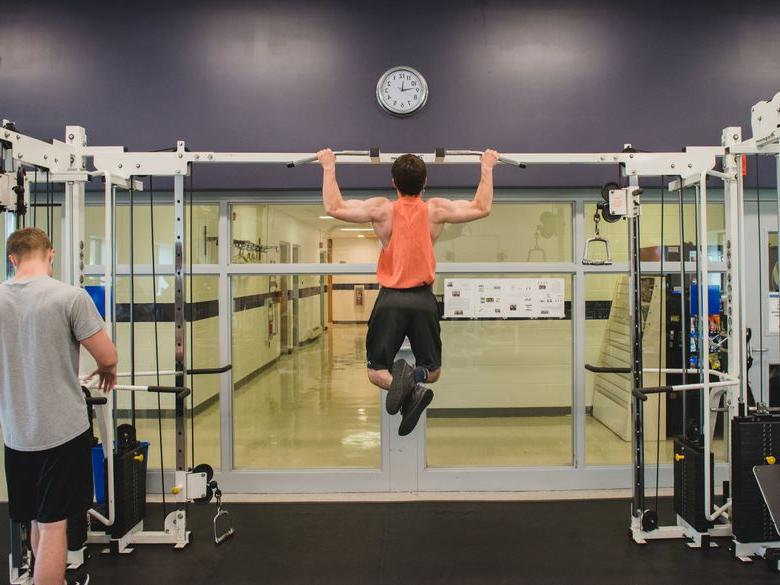 Student uses weight room at Multipurpose Activities Center (MAC)